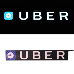 new long glowing uber sign lit and unlit