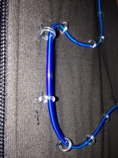 hoops sewn onto clothing to hold glowing el wire