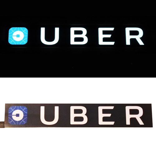 new long glowing uber sign lit and unlit